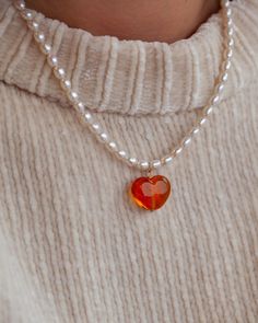 Introducing our Autumn heart necklace! Featuring our brand new Amber Heart charm! Every picnic blanket piece is lovingly designed and handcrafted completely in-house and perfectly finished in our jewellery studio. All of our pearly jewellery features only the highest quality iridescent freshwater pearls.  Every individual glass feature charm takes around half an hour to delicately form by hand in the flame, reaching temperatures of up to 800 degrees celsius, before heading to the kiln to soak fo Necklace Glass Beads, Jewellery Studio, Amber Heart, Heart Charm Necklace, Jewelry Studio, The Flame, Body Jewellery, Glass Jewelry, Charm Jewelry