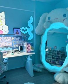 a room with a desk, mirror and stuffed animal