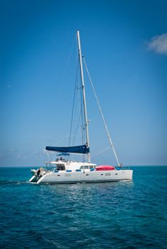 a sailboat in the ocean on a sunny day