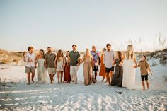 a group of people standing next to each other on top of a snow covered field