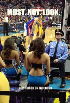 two police officers are sitting in front of some cheerleaders at a basketball game, and the caption reads must not look cop humor on facebook