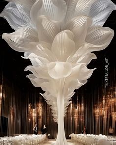 a large white vase sitting on top of a table