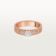 Cartier - LOVE Solitaire - Ring Woman Pink gold/Diamond - LOVE solitaire, 18K rose gold (750/1000), set with a brilliant-cut diamond available from 0.30 to 0.34 carat and paved with brilliant-cut diamonds. Please note that the carat weight, number of stones and product dimensions will vary based on the size of the creation you order. For detailed information please contact us. Rings Cartier, Cartier Wedding Rings, Diamond Ring Cuts, Cartier Love Ring, Cartier Love, Cartier Ring, Love Ring, Gold Platinum, Jewelry Rings Engagement