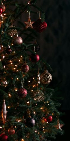 a christmas tree with ornaments and lights on it