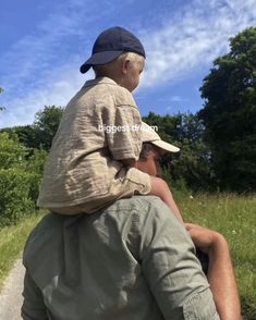 a man holding a small child on his back