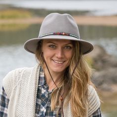 The Aspen takes style-conscious ladies to modern frontiers. Soft, warm wool felt in a Western-inspired silhouette feels at home even on urban ranges with a decorative hatband in multicolored beads. Internal adjustable sizing and sweatband make it feel as good as it looks. This hat makes a statement with both dresses and jeans, and looks smashing accessorized with boots and scarves. Felt Fedora, Mountain Hiking, Hat Band, Hat Making, Western Wear, Aspen, Wool Felt, Fedora, Felt