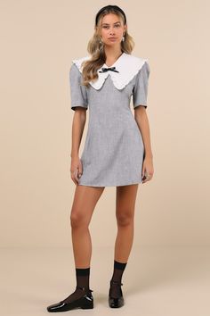 Sophisticated and playful at the same time, the Sister Jane Heron Heather Grey Bow Oversized Collar Short Sleeve Mini Dress is our new fave find! Midweight woven fabric boasts a heathered effect as it shapes short sleeves and a fitted bodice that features an oversized, statement collar with ruffled trim and a removable beaded bow detail. Fit-and-flare silhouette falls to a mini hem. Hidden zipper at back. Fit: This garment fits true to size. Length: Mid-thigh. Size uk m/us 6 measures 33.5" from shoulder to hem. Bust: Great for any cup size. Waist: Fitted - very fitted at natural waist. Hip: Not Fitted - fuller skirt allows room for hips. Undergarments: May be worn with any standard bra. Fabric: Fabric has no stretch. Lined. Shell: 65% Polyester, 30% Viscose, 5% Elastane. Contrast: 95% Poly Double-breasted Mini Dress With Double Button Closure, Spring Gray A-line Mini Dress, Chic Single-breasted Mini Dress With Lapel Collar, Summer V-neck Mini Dress With Bow, Cotton V-neck Mini Dress With Button Closure, Collar Mini Dress, Beaded Bow, Sister Jane, Statement Collar