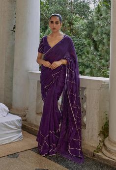 Add a splash of festivity to your wardrobe with the vibrant Titli Saree. Crafted from lightweight linen gauze fabric in bold hues of fuchsia and purple, this saree is perfect for the festive season. Adorned with intricate gota work, the Titli Saree ensures you stand out with its playful colors and shimmering details, making every moment feel as bright and lively as you. MODEL DETAILS Model Name- Mohini  Vitals Height- 5.8 Bust- 34 Waist- 26.5 Hip- 35 Shoulder- 15.5 Fabric: 100% Linen Characteristics of Linen : Hygroscopic All Natural UV Protection Kind On Skin Naturally Breathable Strong Improves With Age Handmade With Love In India By Yell Retail India. Purple Pre-draped Saree With Zari Work For Celebration, Purple Georgette Pre-draped Saree For Festivals, Festive Fusion Pre-draped Saree For Diwali, Summer Chanderi Saree With Dupatta, Chanderi Saree With Dupatta For Summer, Elegant Cotton Silk Saree In Purple, Purple Georgette Pre-draped Saree For Eid, Purple Tissue Silk Pre-draped Saree With Sheer Dupatta, Purple Pre-draped Saree With Dupatta