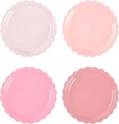 four pastel pink plates with scalloped edges on a white background, each in different colors