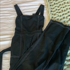 Super Cute Black Jumpsuit From Hollister. I Ordered This Online And Accidentally Bought The Wrong Size But This Is The Cutest Jumpsuit Ever It Has White Contrast Stitching, Wide Legs, Sway Are Neckline, And Ties In The Back! Nwt Casual Medium Wash Bib Front Jumpsuit/romper, Black Jumpsuit, Cute Black, Hollister, Pant Jumpsuit, Wide Leg, Super Cute, Jumpsuit, Pants For Women