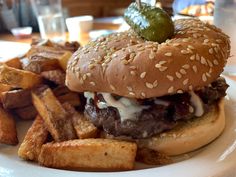 a hamburger and french fries on a plate