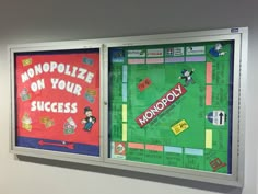 two bulletin boards with words and pictures on them, each depicting a monopoly board game