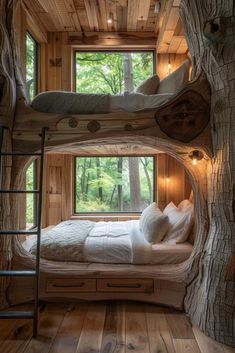 a bedroom with bunk beds made out of tree trunks and windows that look like they have been built into the ground