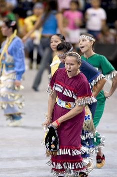 a group of people that are standing in the street with some kind of thing on their head