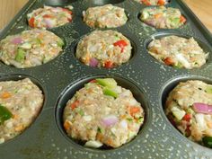 a muffin tin filled with lots of food