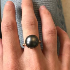 This classic crownwork® ring features a crisp bezel setting and open translucent feel allowing full appreciation of the gorgeous tahitian pearl. Diamond shoulders add a little extra to this beauty, the perfect diamond and pearl combo MATERIAL: 18k yellow gold STONE TYPE/CARAT WEIGHT: Tahitian Pearl, Diamond 0.16cts 12mm DIMENSIONS: 0.472'' Luxury Yellow Gold Ring With Tahitian Pearl, Tahitian Pearl Ring, Swords Medieval, Sapphire Pendant, Tahitian Pearls, Gold Stone, Pearl Diamond, Pinky Ring, Yellow Sapphire