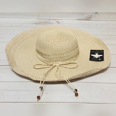 *New With Tags *Inner Band: Approx. 18.5" *Brim: Approx. 5.31"W *Crown: Approx. 4.72"H *Fit: Fitted: Slightly More Relaxed Than A Close Fit; Still Outlines Figure But Not Tightly *Content: 100% Paper *Fabrication: Woven Paper Straw *Embellishment/Trim: Braided Self-Fabric Tie Around Base Of Crown With Beaded Ends *Style: Floppy Sun Hat *Crown: Round *Brim: Wide, Flat Floppy *Interior: Grosgrain Fabric Headband *Stay Away From The Rays In This Oversized Straw Hat, Featuring A Wide, Floppy Brim Pe Sun And Beach, Floppy Sun Hat, Floppy Sun Hats, Fabric Headbands, Paper Straws, Beach Hat, Woven Paper, Sun Hat, Straw Hat