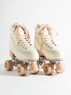 a pair of roller skates with pink wheels