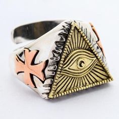 Old as the hills, the Eye of Providence, otherwise known as the All-Seeing Eye, is one of the most peculiar symbols out there. It is even stranger to see it in jewelry. Nevertheless, if incongruous jewelry is up your alley, don't miss your chance to flaunt this outlandish Eye of Providence Ring by our store.The all-seeing eye has many interpretations. In the Christian religion, it means god, and the rays of light emanating from him is his glory. However, this symbol is increasingly associated wi Adjustable Symbolic Metal Rings, Symbolic Adjustable Ring With Unique Design, Symbolic Metal Promise Ring, Symbolic Open Ring In Metal, Symbolic Rings With Unique Design For Gift, Symbolic Metal Rings As Gifts, Symbolic Metal Ring As A Gift, Handmade Symbolic Bronze Rings, Symbolic Handmade Metal Rings