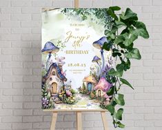 an easel with a birthday card on it next to a plant and brick wall