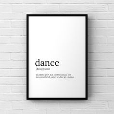 a black and white poster hanging on a brick wall with the words dance above it