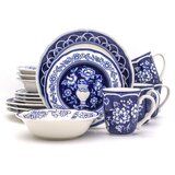 a blue and white dinnerware set on a white background