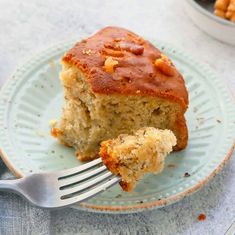 a piece of cake sitting on top of a plate with a fork next to it