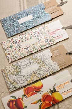 four tags are laid out on the table to show different designs and colors, including peaches