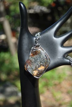 Marcasite plume agate is an unusual agate type that contains marcasite inclusions. Marcasite is an iron oxide similar to hematite and this is the silvery speckling and feathering you see. We cut and polished a free form cabochon from a rough specimen (see photo 10), then used stainless steel wire to form the pendant. I used stainless steel chain and findings to complete the necklace. (Let us know if you need a different necklace length than 22 inches). The dimensions of the cabochon are approximately: 1.6 x 1.2 x 0.16 inches. Thank you for shopping with small business! Love this handmade natural stone necklace? Please check out our other creations on our Etsy Home Page: www.etsy.com/shop/Rocks2Gems2Wire PLEASE read our policy and jewelry care information below before ordering and Thank You Unique Freeform Agate Necklace, Spiritual Agate Necklace With Raw Stone, Agate Large Pendant Necklace In Nature-inspired Style, Spiritual Agate Pendant Jewelry, Etsy Home, Artisan Agate Nickel-free Necklaces, Natural Stone Necklace, Plume Agate, Natural Stones Necklace