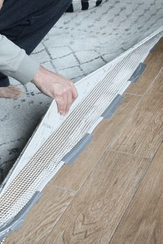 a person laying on the ground with their hand over an area that has been laid out