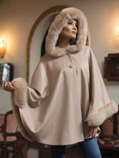 Annika Alpaca Cape: Cream Luxury Winter Poncho, Luxury Cape With Faux Fur Trim, Winter Cape-shaped Faux Fur Coat, Faux Fur Winter Cape Coat, Winter Faux Fur Cape Coat, Winter Poncho With Faux Fur Trim, Elegant Faux Fur Winter Cape, Winter Faux Fur Poncho With Trim, Elegant Faux Fur Cape With Lining