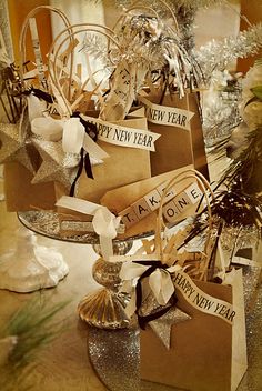 new year's gifts are stacked on top of each other with ribbons and bows