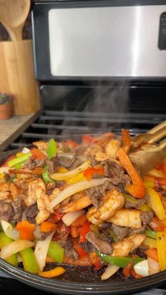 the food is being cooked on the grill with chopsticks in it's mouth