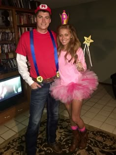 a man and woman dressed up in costumes