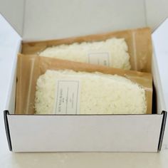 two pieces of rice in a box on a table