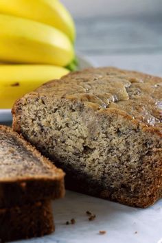 a loaf of banana bread next to some bananas