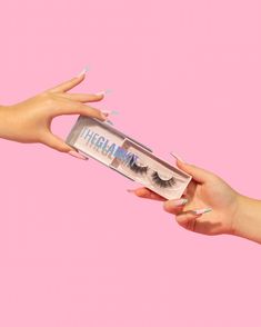 Two hands wearing blue press on nails holding a pair of lashes on a pink background Colourful Still Life, Product Photography Styling, Business Photoshoot, Small Business Advice, Business Content, Salon Interior Design, Photography Styling, Makeup Photography