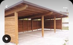 an outdoor covered parking lot with wood slats