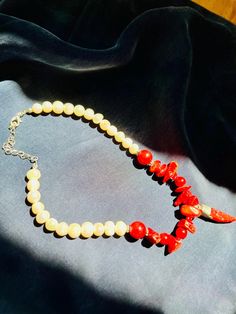 This unique necklace, in which we combined real pearls and corals, was carefully produced for you. The relaxing properties and visually unique nature of coral stone make this necklace more than just an accessory.   Known properties of coral stone; - Gives peace and calms down. - It opens the mind. - Strengthens communication. -It is effective in maintaining emotional balance. This healing and unique necklace is made of real pearls. Our limited edition necklace makes a great anniversary gift. Nec Elegant Red Coral Gemstone Necklace, Spiritual Red Coral Necklaces With Polished Beads, Spiritual Red Coral Necklace With Polished Beads, Red Coral Gemstone Beads Necklace As Gift, Gift Red Coral Gemstone Beads Necklace, Red Coral Gemstone Beads Necklace For Gift, Handmade Red Coral Pearl Necklace Gift, Handmade Elegant Red Coral Pearl Necklace, Elegant White Red Coral Necklace