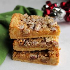 three bars stacked on top of each other next to a green napkin and christmas decorations