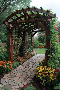 a garden with lots of flowers and plants around it