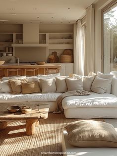 a living room filled with furniture next to a large open window covered in lots of natural light