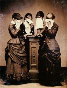 an old black and white photo of three women standing next to each other