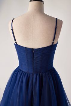 This navy blue dream is crafted in pleated tulle material, boasting a fitted bodice with spaghetti straps, an empire waistline and built-in-bra. Ready to dance the night away, this mini dress features a zip-up back and a length abover the knee! Blue Dresses With Sweetheart Neckline And Straps, Blue Sweetheart Neckline Dress With Straps, Blue Dress With Straps And Sweetheart Neckline, Blue Dress With Adjustable Straps And Fitted Bodice, Blue Tulle Dress With Spaghetti Straps, Sleeveless Tulle Dress With Delicate Straps, Homecoming Dresses With Ruched Bodice And Spaghetti Straps, Tulle Dress With Adjustable Spaghetti Straps, Party Dresses With Adjustable Straps In Tulle