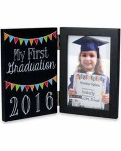 a graduation photo frame with the words my first graduation in black and colorful pennants