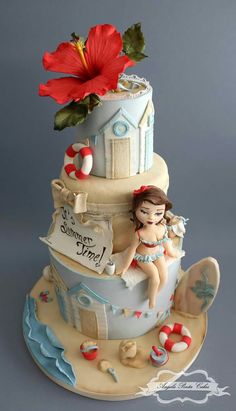 there is a cake that has a girl on the top and a life preserver attached to it