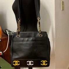 Authentic Chanel Triple Cc Logo Chain Shoulder Leather Tote Bag. The Bag Is Showing Normal Wear Condition Exterior Dyed Black Originally Color Is Beige All The Chanel Logo Has Been Painted In Gold And Sliver Come With Dust Bag 11.0” X 9.0” X4.0” The Serial Number Intact The Shoulder Strap Drop 15.0” You Will Received Exactly What You See In All The Pictures Because All The Pictures Come From The Real Item Please Refer All The Pictures And Description Of The Item Before You Purchase Please This Sale Is Final Guarantee Money Refund For Authentic Serious Buyer Only Please Thank You So Much Chanel Logo, Cc Logo, Leather Tote Bag, Chanel Bag, Leather Tote, Dust Bag, Shoulder Strap, Chanel, Bag Lady