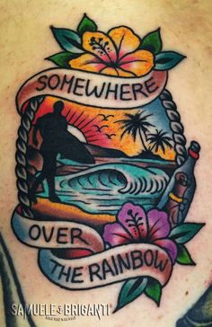 a man with a tattoo on his back that says somewhere over the rainbow