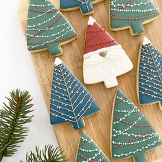 decorated christmas cookies on a cutting board