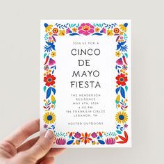 a person holding up a card with the words cinco de mayo fiesta on it